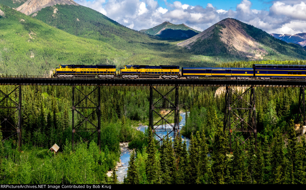 Northbound passenger train across Riley's Creek Trestle in Denali National Park